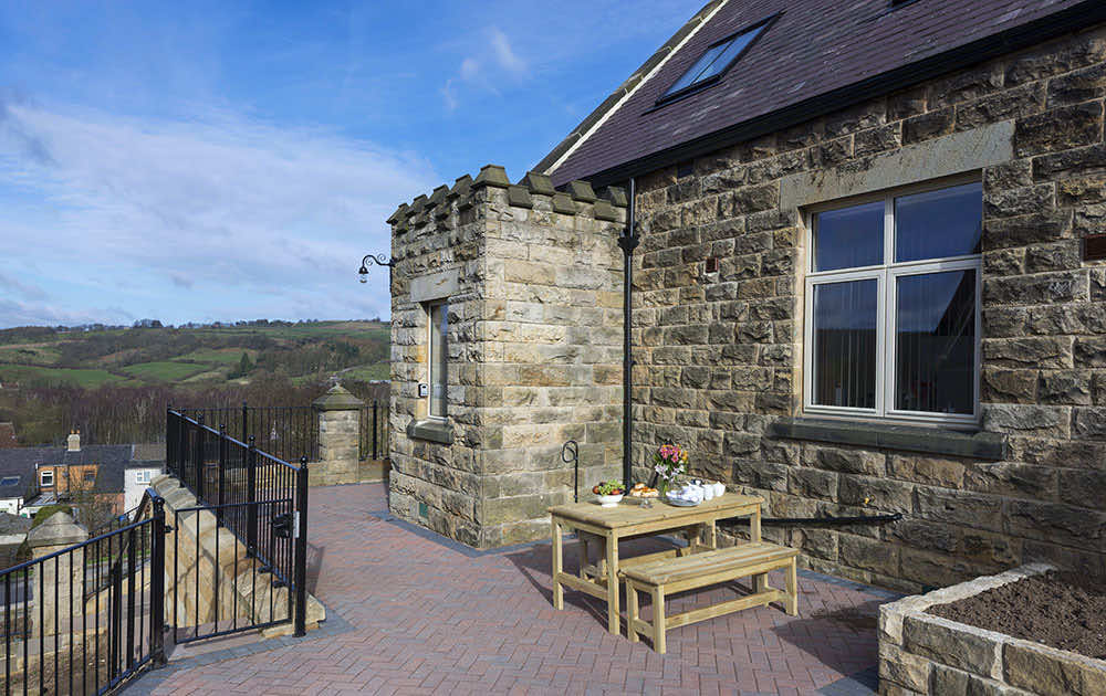 Patio seating with countryside views at a North York Moors cottage